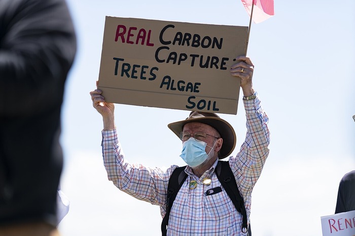 man holding a sign